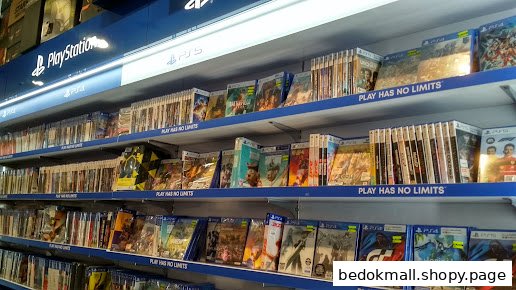 Shelves filled with PlayStation video game cases in a retail store.