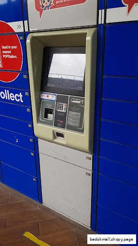 An automated parcel locker system with a central screen and blue lockers.
