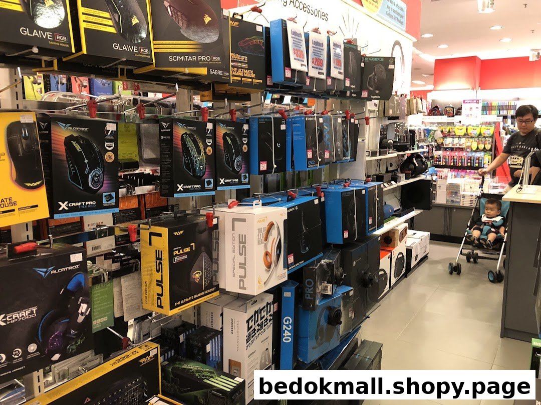 Interior view of a retail store aisle displaying packaged electronics and accessories.