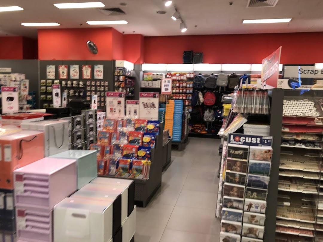 Interior view of a retail store with various products on shelves and displays.