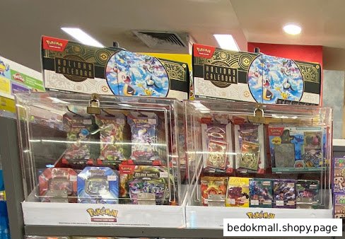 Display of Pokémon trading cards and merchandise inside a store.