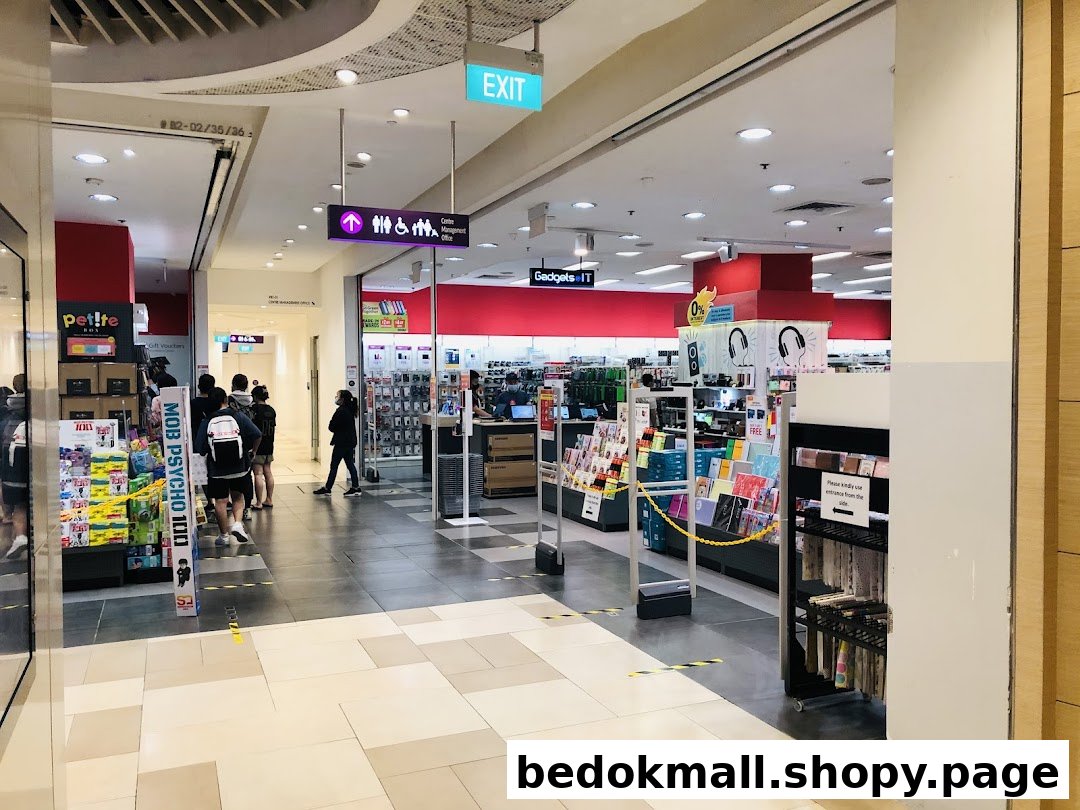 Interior view of a large retail store with various products and people.