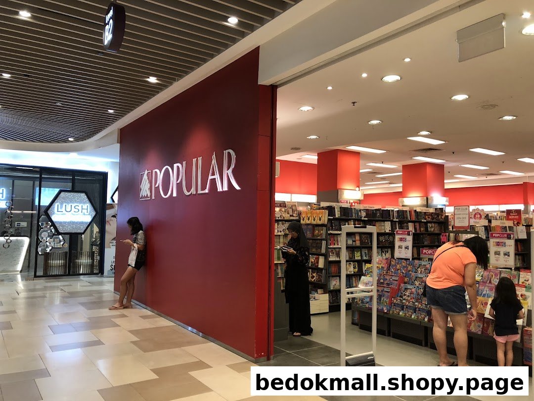 Entrance of POPULAR bookstore with its logo and people inside.