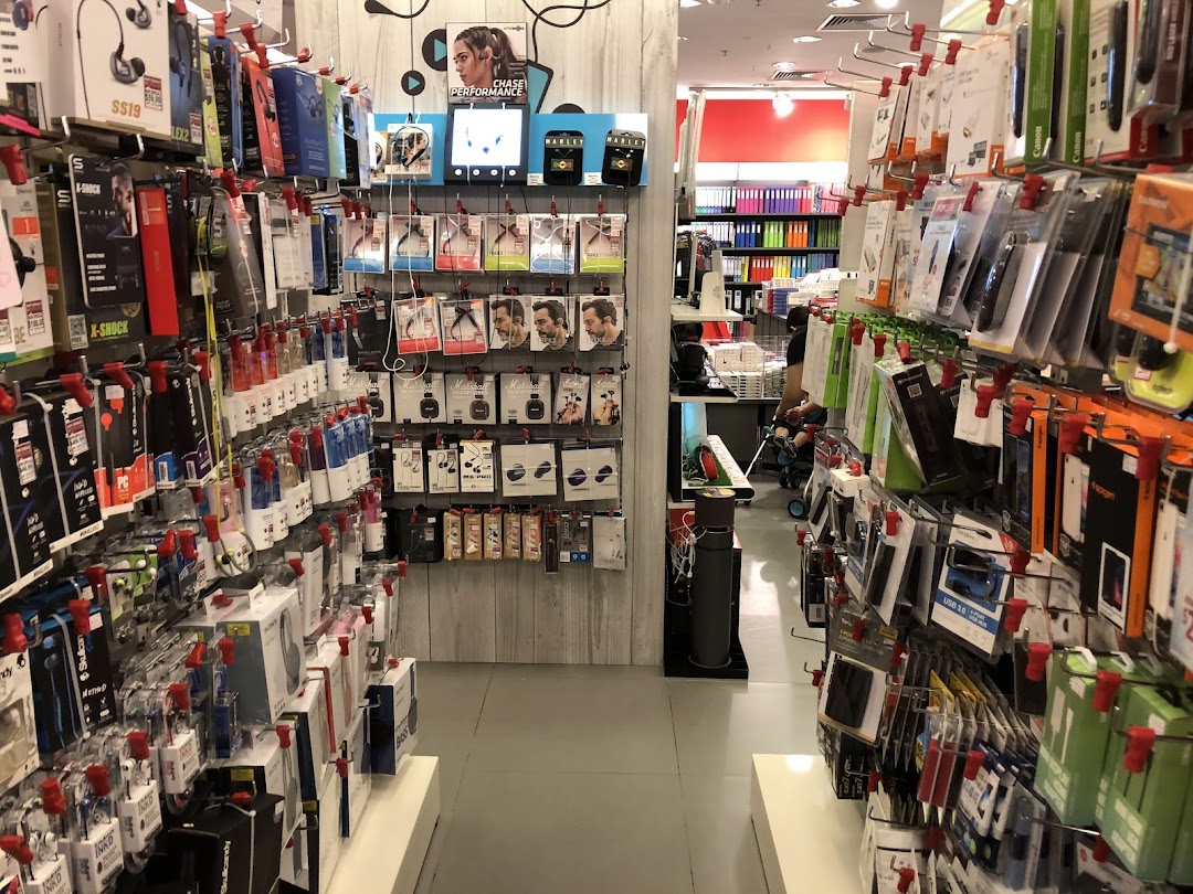 Interior view of a shop aisle displaying numerous packaged electronics accessories.