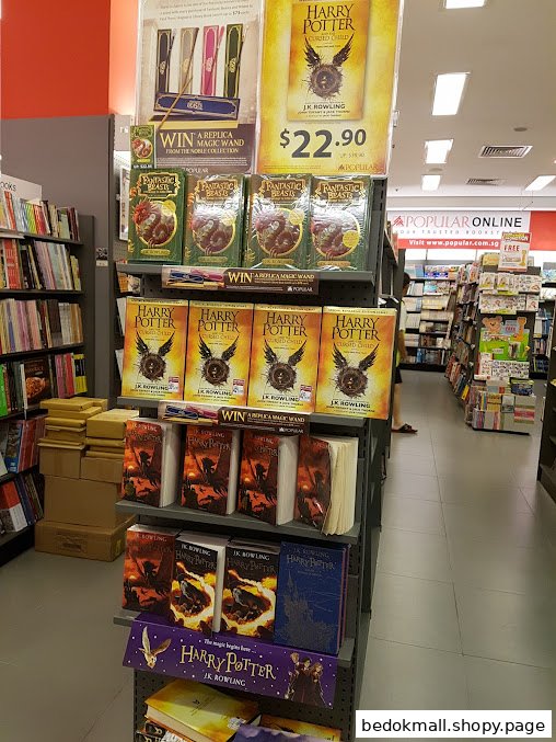Bookstore interior with a prominent display of Harry Potter and Fantastic Beasts books.