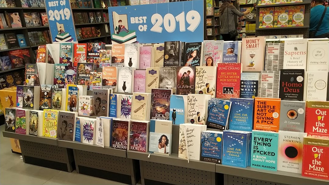 Bookstore interior showing a large display of books, including 'Best of 2019' titles.