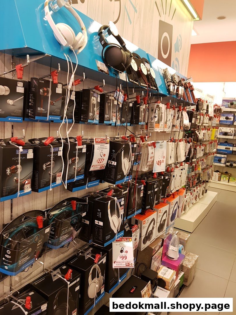 Interior view of a shop displaying headphones and audio equipment on shelves.