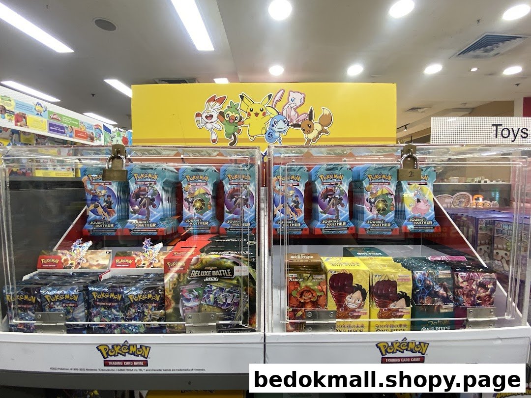A display case filled with Pokemon and One Piece trading cards inside a shop.