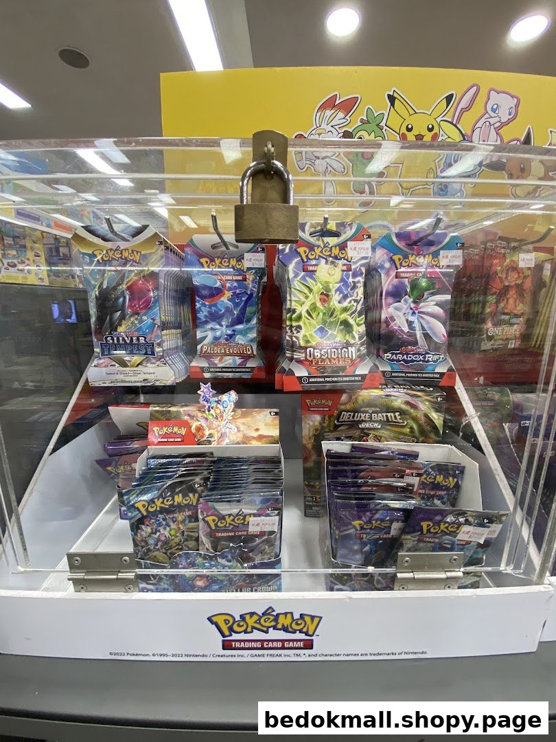 A clear display case filled with various Pokémon trading card game products.