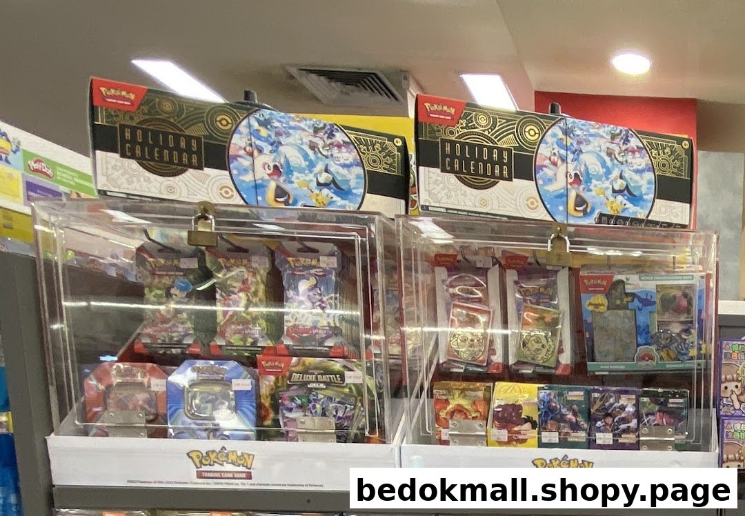 Two display cases filled with Pokémon trading card game products.