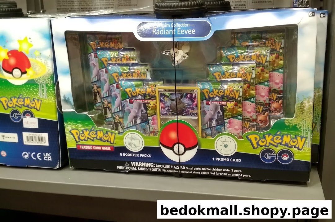 A Pokemon Trading Card Game box set featuring Radiant Eevee on a shelf.