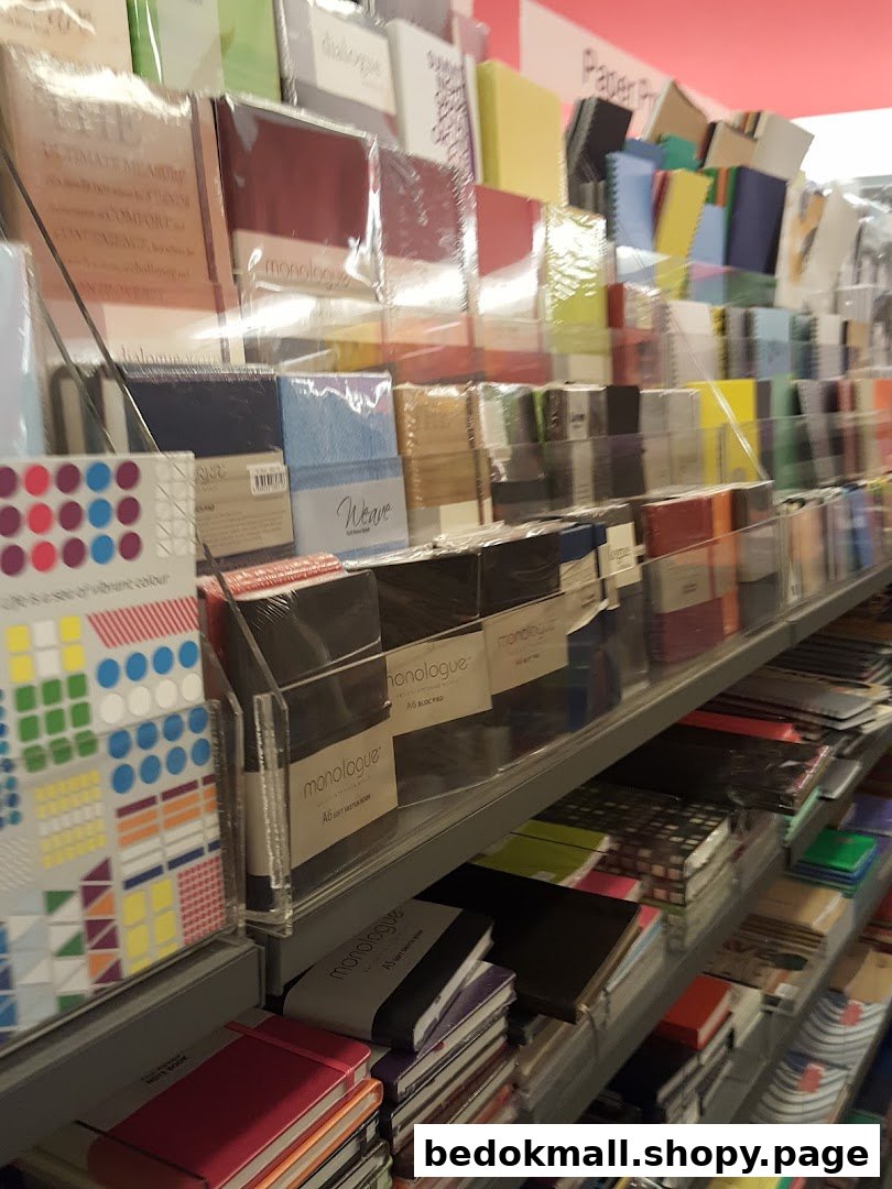 Shelves filled with colorful notebooks and stationery items in a store.