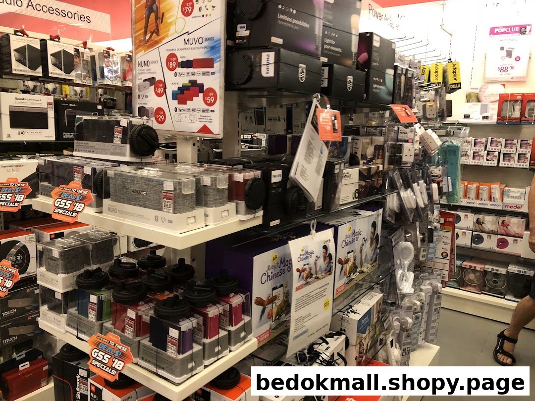 Interior view of a retail store displaying electronics and accessories on shelves.