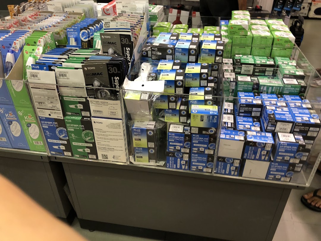 Display of correction tapes and stationery products inside a bookstore.