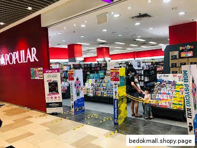 Entrance of a Popular Bookstore with red walls and visible interior.