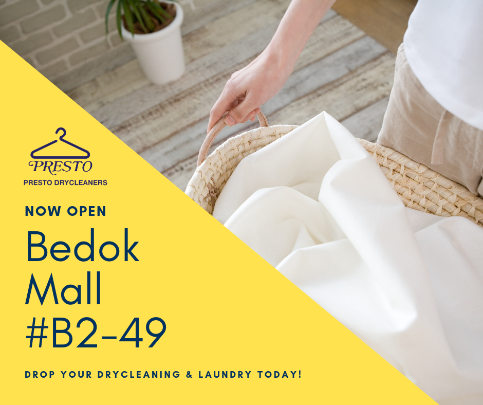 Promotional image showing a hand with laundry and new store opening details.