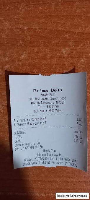 A retail receipt from Prima Deli showing purchased items and transaction details.