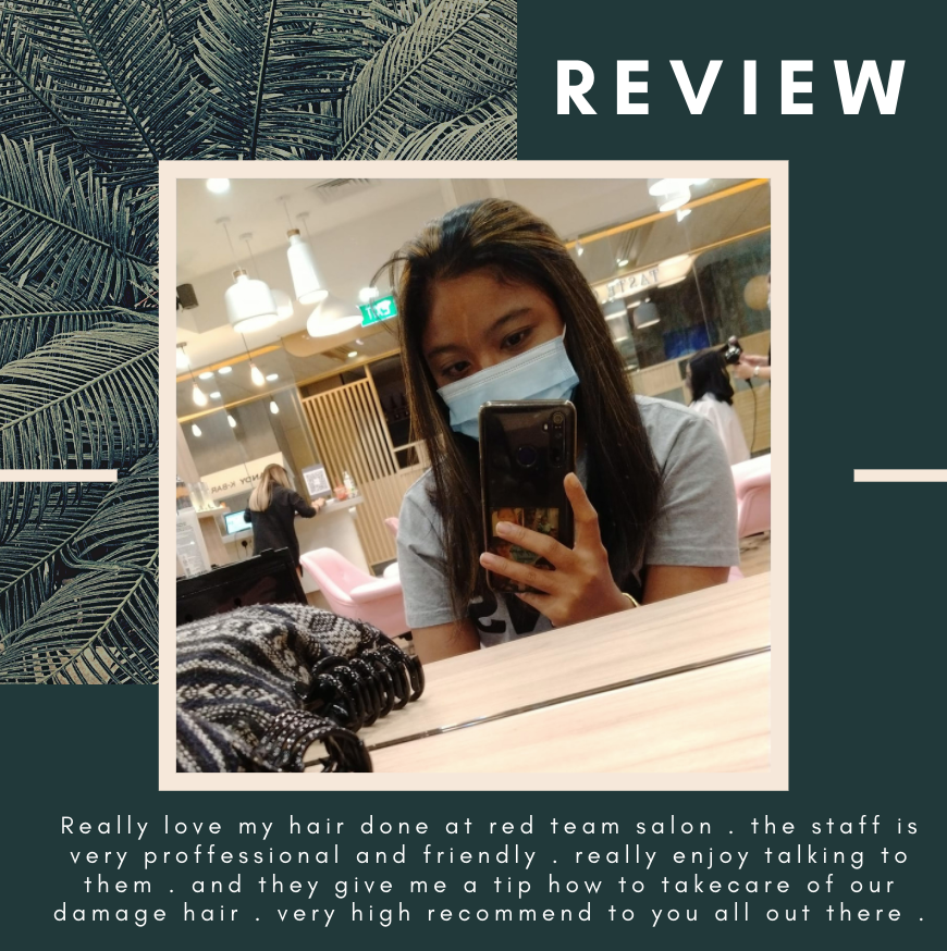 Person taking a selfie inside a hair salon with a review overlay.