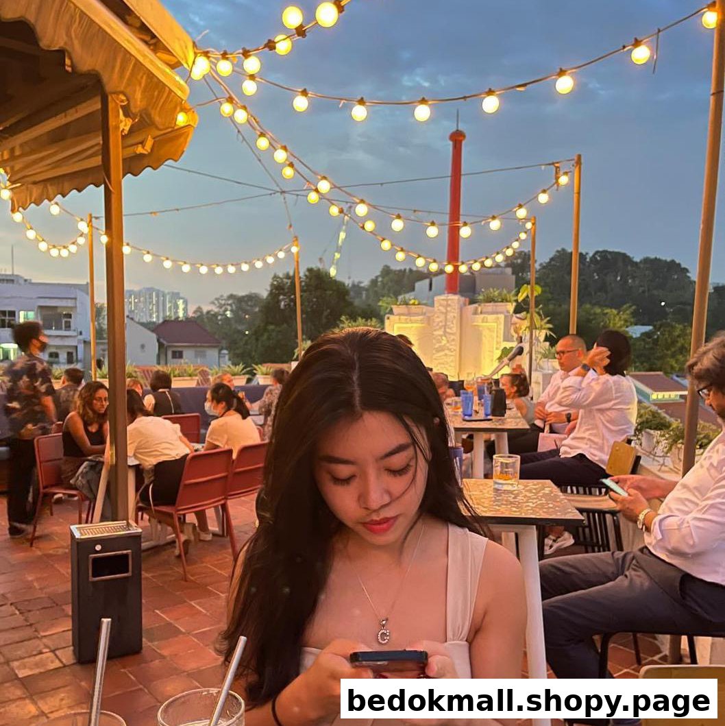 Young woman on a rooftop patio at dusk with string lights.