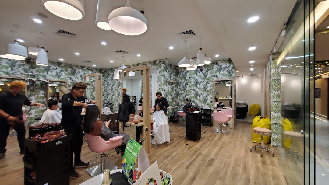 Interior of a hair salon with stylists working on customers.