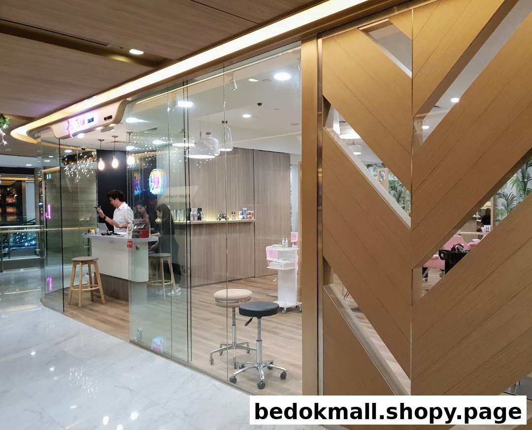 Glass entrance of a hair salon showing reception desk and staff inside.