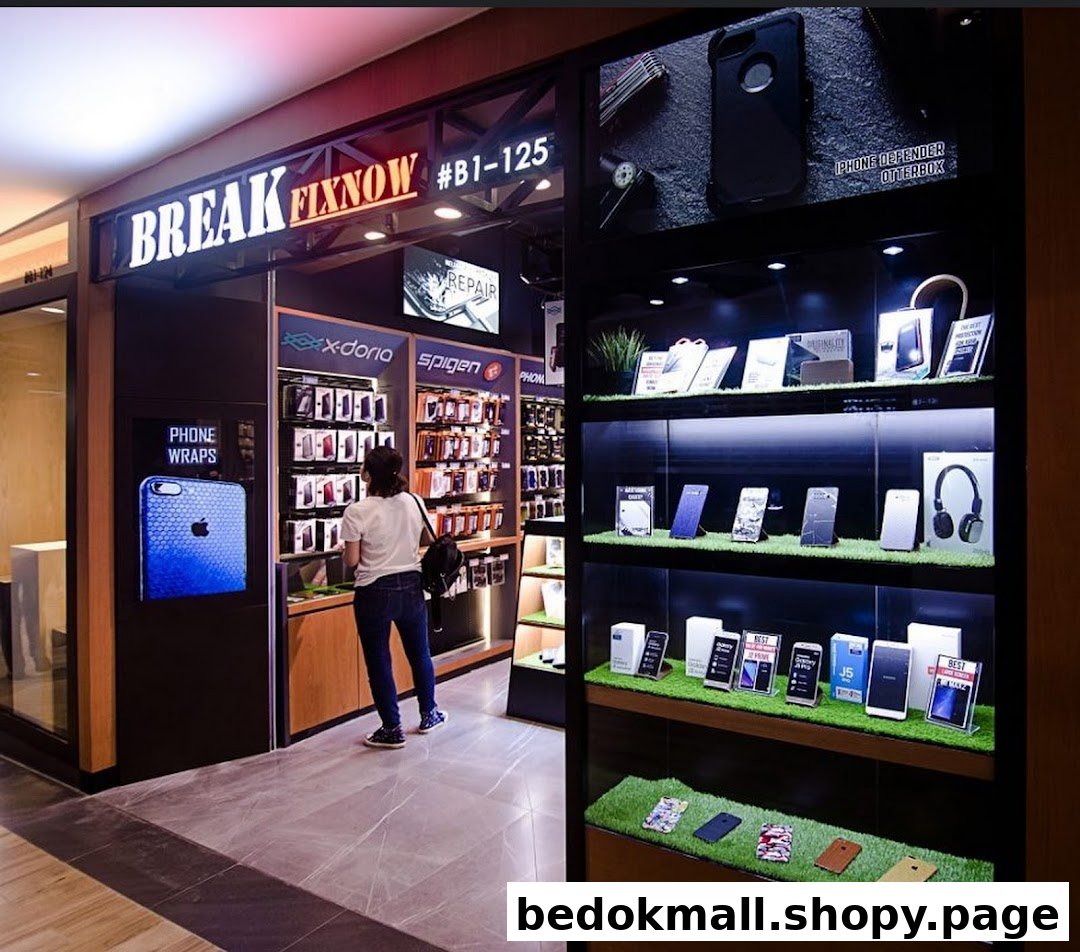 Shop entrance with displays of phone accessories and a customer inside.