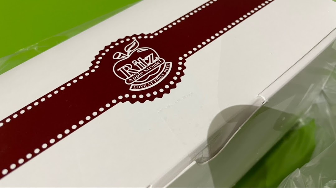 Close-up of a white Ritz Apple Strudel product box with logo.