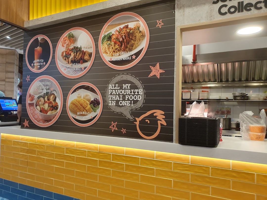 Counter with visual menu of Thai food items and a kitchen area.