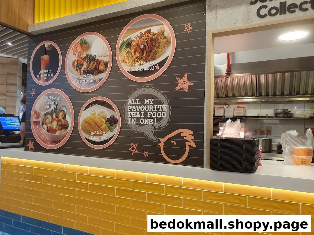 Counter with visual menu of Thai food items and a kitchen area.