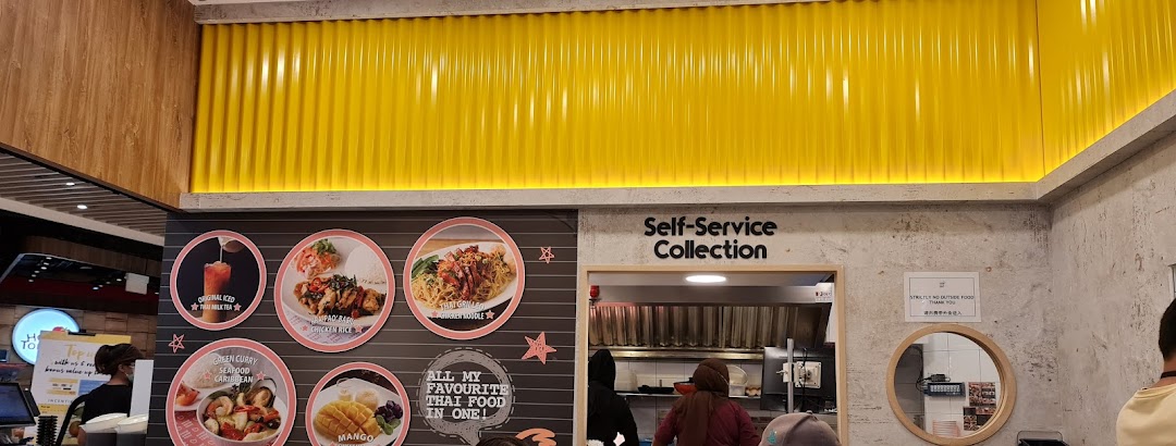 Interior of a Thai shop with food display and self-service collection area.