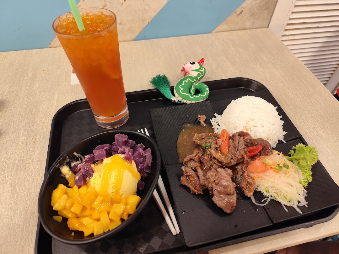 A meal with beef, rice, dessert, and a drink on a tray.