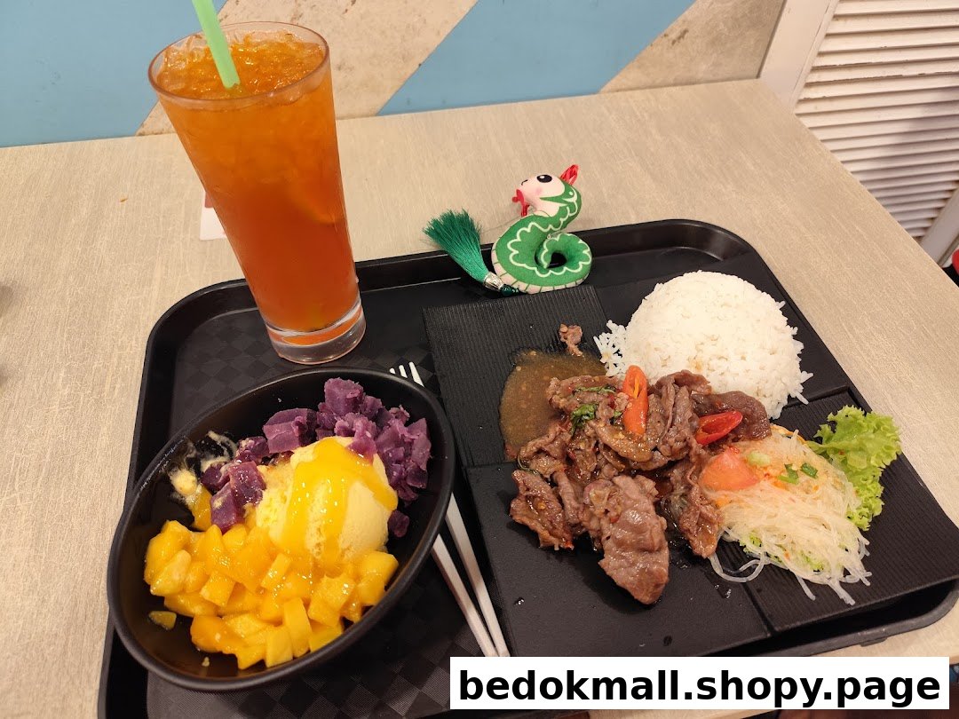 A meal with beef, rice, dessert, and a drink on a tray.