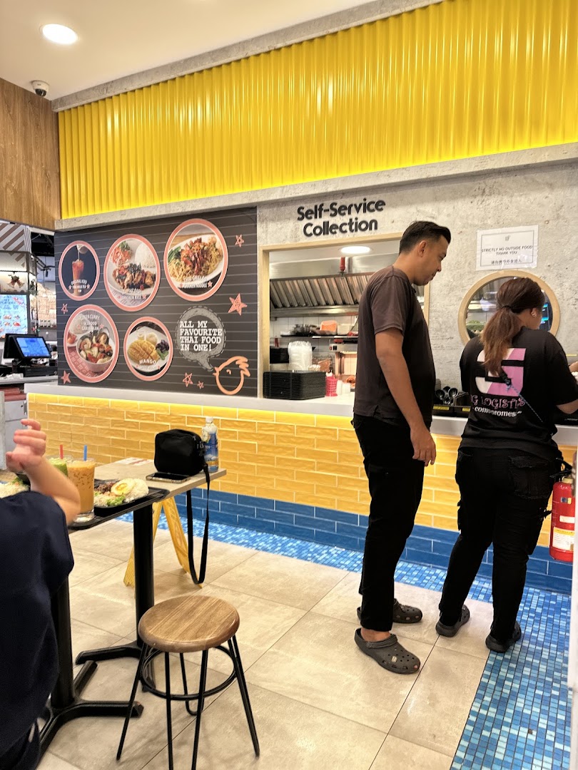 Interior view of a Thai restaurant with customers and a self-service counter.