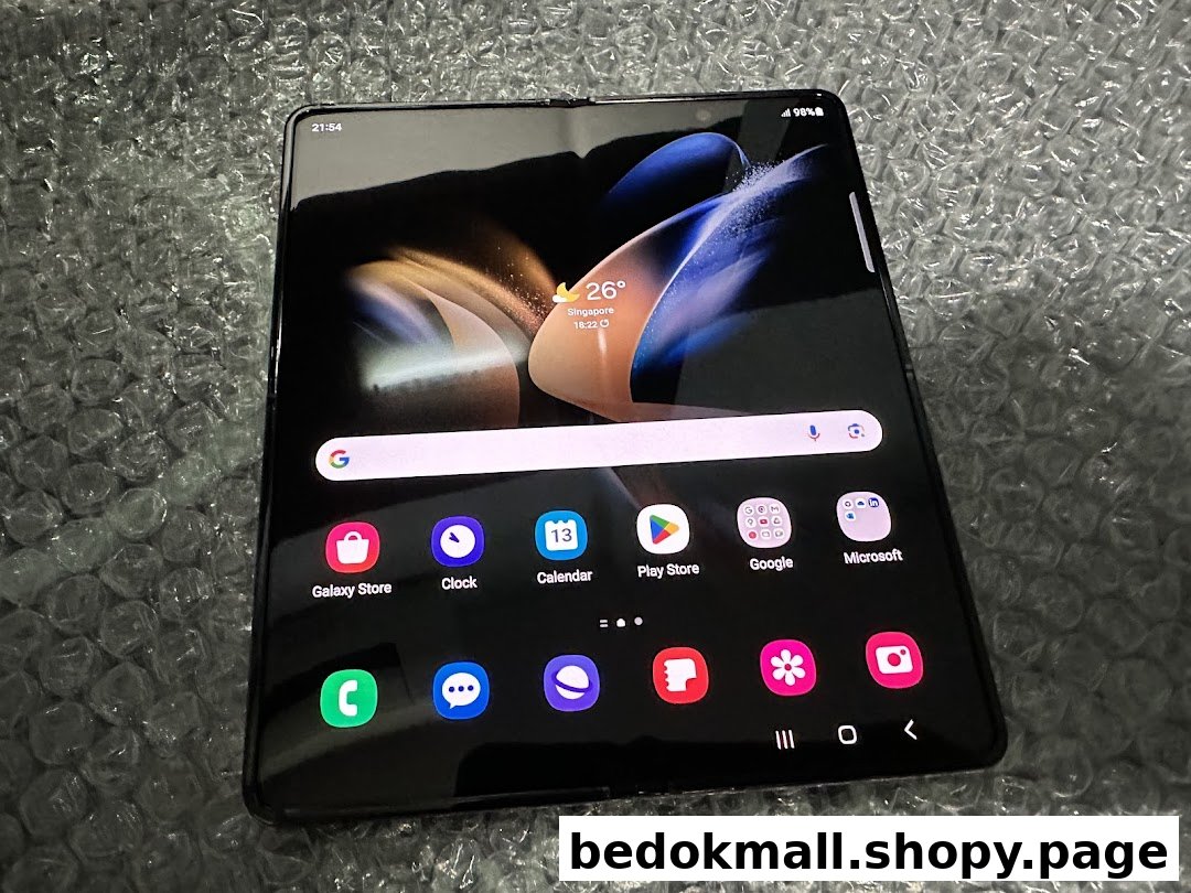 A Samsung foldable phone displaying its home screen on bubble wrap.