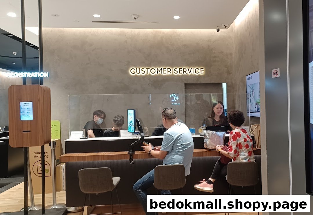 Customers and staff at a Samsung customer service counter.