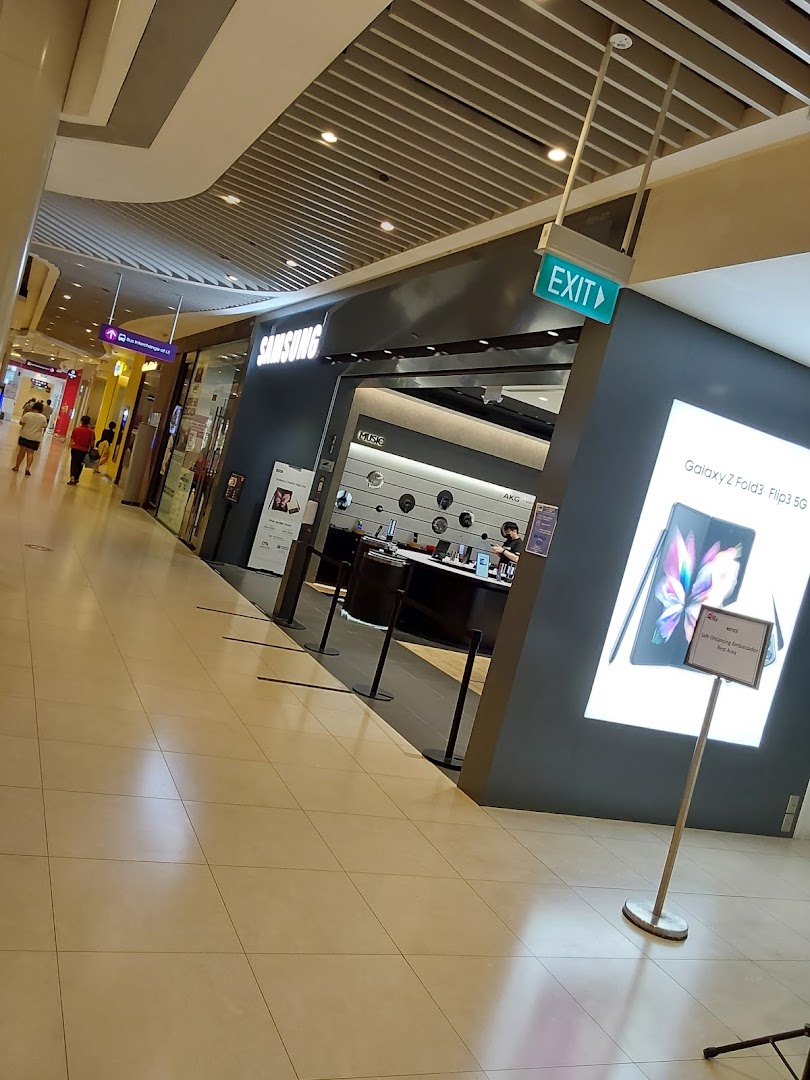 Samsung store entrance from a mall hallway with product display.