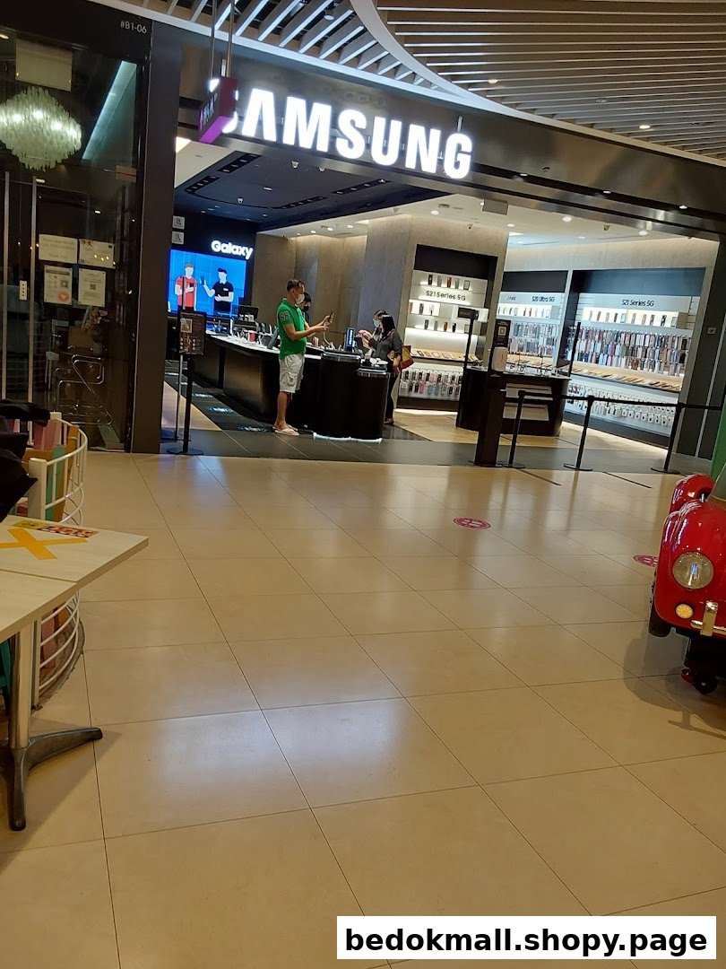 Samsung Experience Store entrance showing interior and customers.
