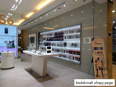 Interior of a Samsung store with display tables and accessories.