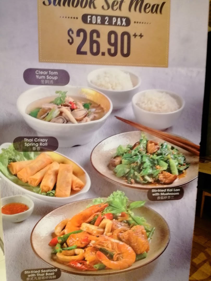 A menu board showcasing the Sanook Set Meal for 2 Pax with various Thai dishes.