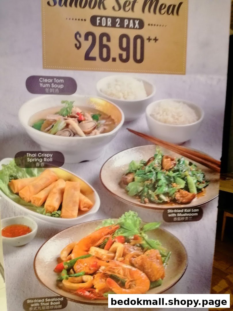 A menu board showcasing the Sanook Set Meal for 2 Pax with various Thai dishes.