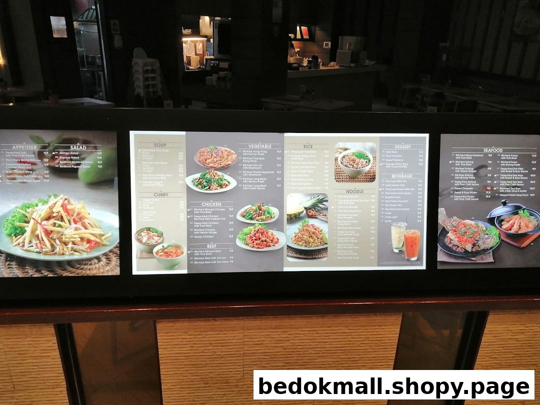 A digital menu board showcasing a wide variety of Thai dishes, drinks, and desserts.