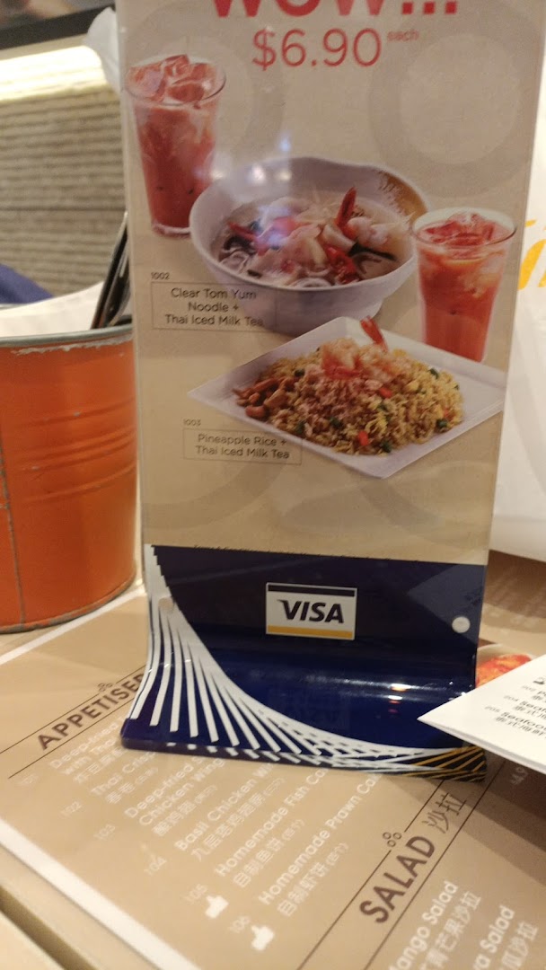 Close-up of a restaurant menu display showing food items and prices.
