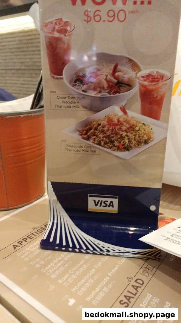 Close-up of a restaurant menu display showing food items and prices.