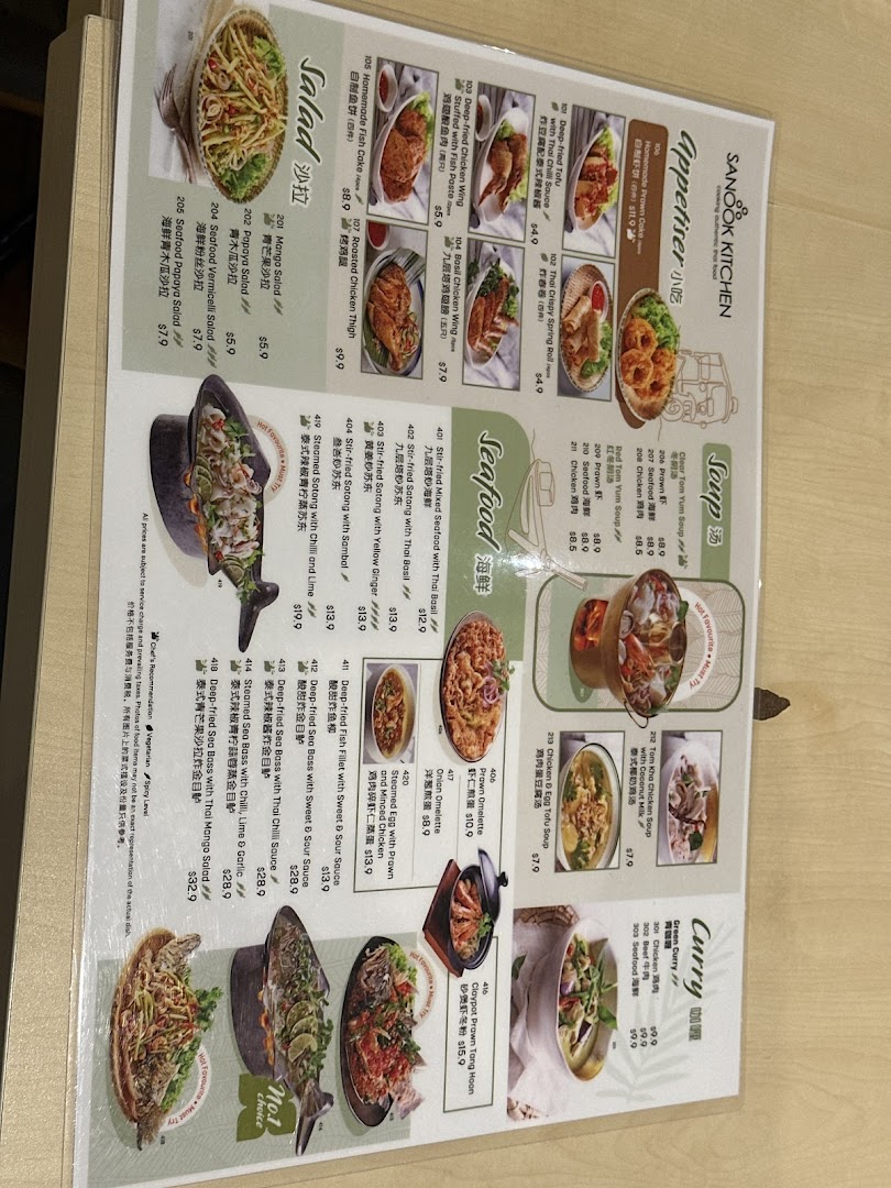 A laminated menu displaying various Thai food dishes with images and prices.