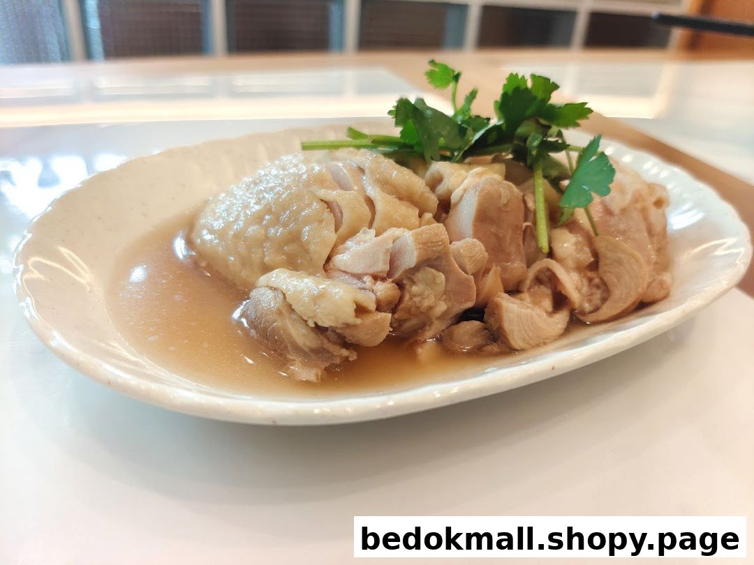 A plate of cooked chicken with sauce and green garnish.