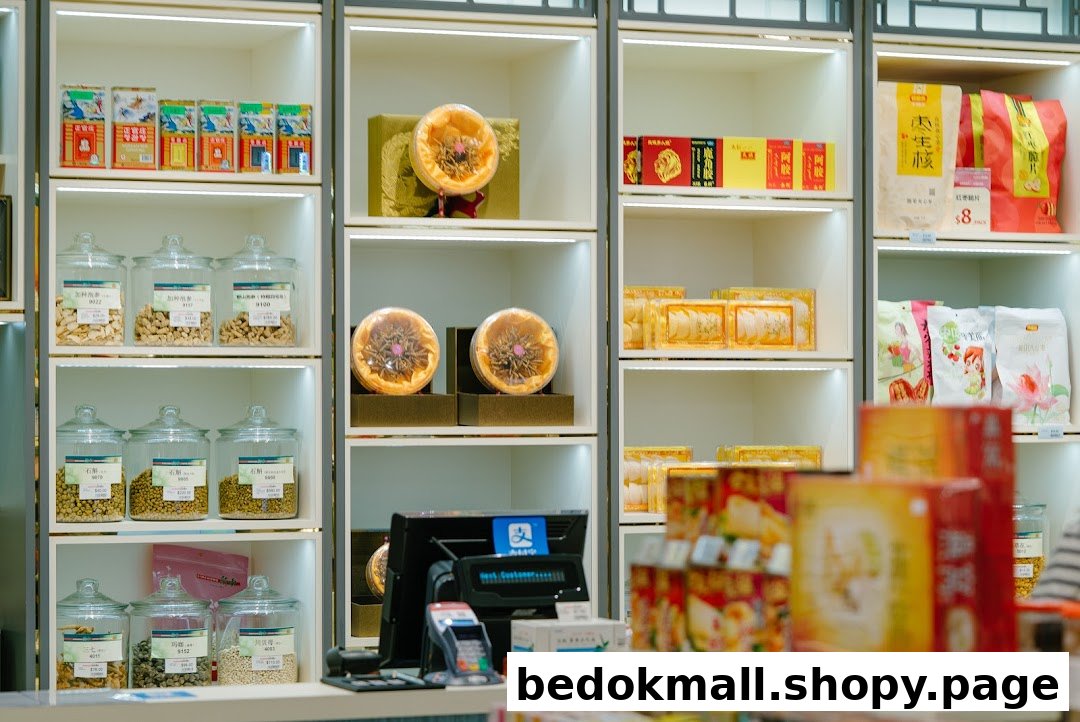 Shelves stocked with various products and a cash register inside a shop.