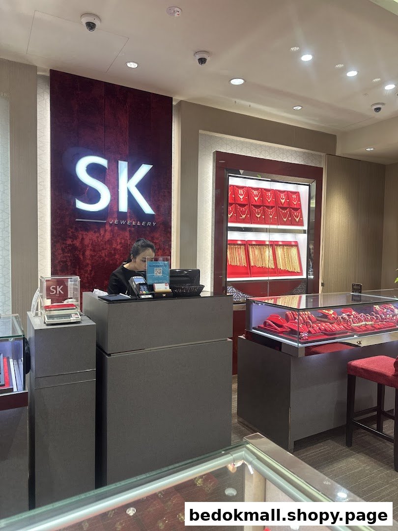 Interior view of a jewellery shop with staff and display cases.