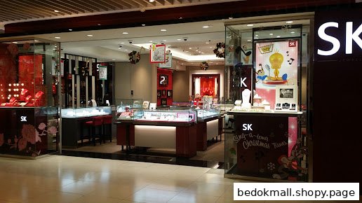 Jewelry shop entrance with display cases and Christmas decorations.