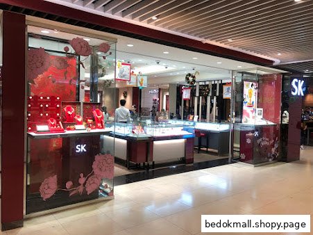 Exterior view of a jewelry shop with display windows and entrance.