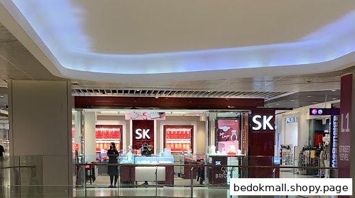 Front view of SK Jewellery shop in a mall with display cases.